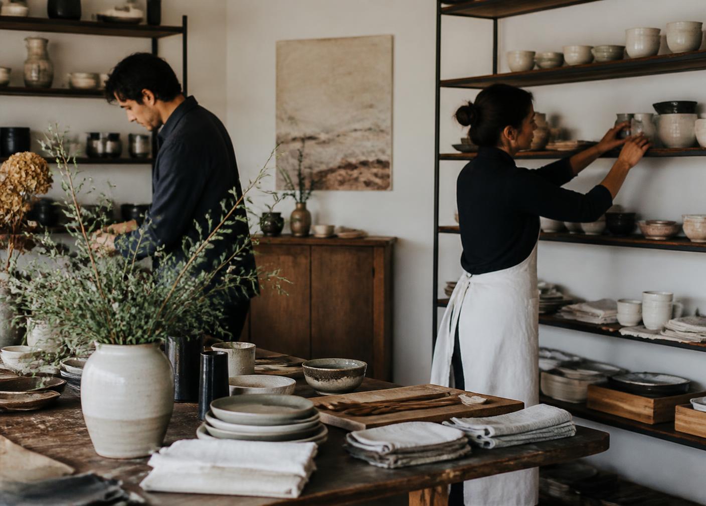Staff arranging shelves inside an independent neighborhood shop